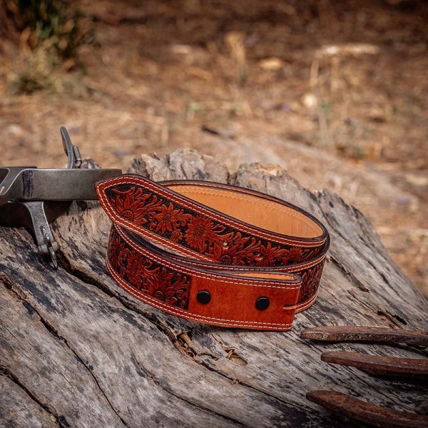 A brown full grain leather belt for women featuring tooled sunflower pattern 